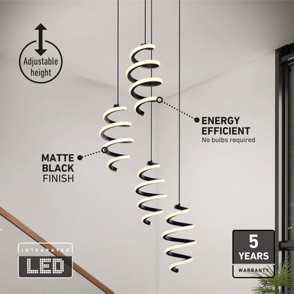 Modern staircase with two Artika Chorus 4 light LED pendants. Matte black finish, integrated LED, adjustable height, energy efficient. Features 5 CCTs, “no bulbs required,” and a 5-year warranty.