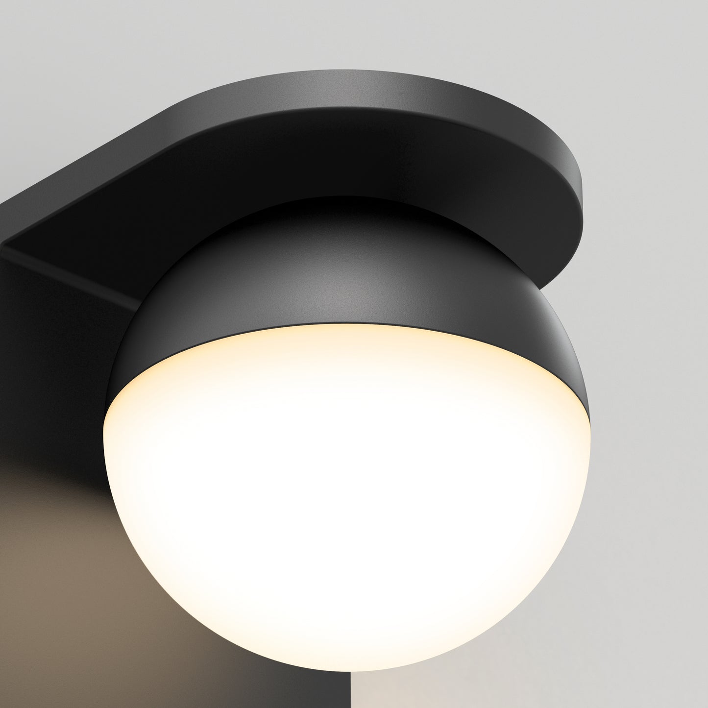 The Artika Bloom indoor-outdoor LED wall light 3 CCT features a modern black wall-mounted design with a rounded white bulb on a sleek curved bracket, shown against a light gray background.