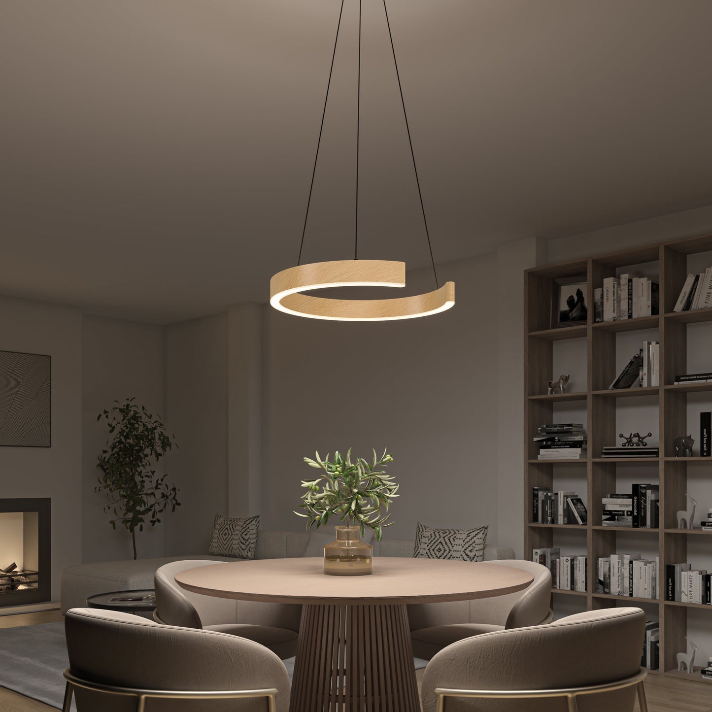 A modern dining room features a round wooden table, four cushioned chairs, a potted plant centerpiece, Artika-CAN-dev’s Vance modern LED pendant light 3 CCT with semicircle design, built-in bookshelves, and neutral decor.