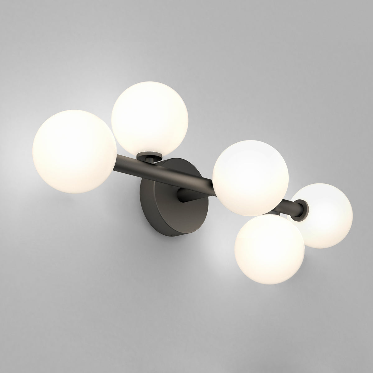 The Artika Bloom 27-in (69 cm) 3-Light Modern LED Vanity Light boasts a black base and three frosted white glass globes, making it perfect bathroom lighting for a light gray wall.