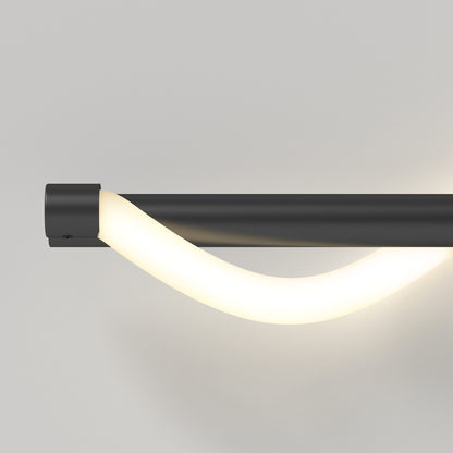 The Artika Neon modern LED bathroom vanity light 5 CCT features a matte black base and a curved glowing white tube, shown wall-mounted against a plain light gray background.