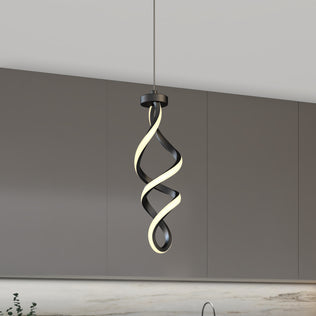 The Artika Mini Swirl LED pendant light, featuring a twisted spiral design, hangs from the ceiling of a minimalist kitchen with gray cabinets and a marble backsplash.