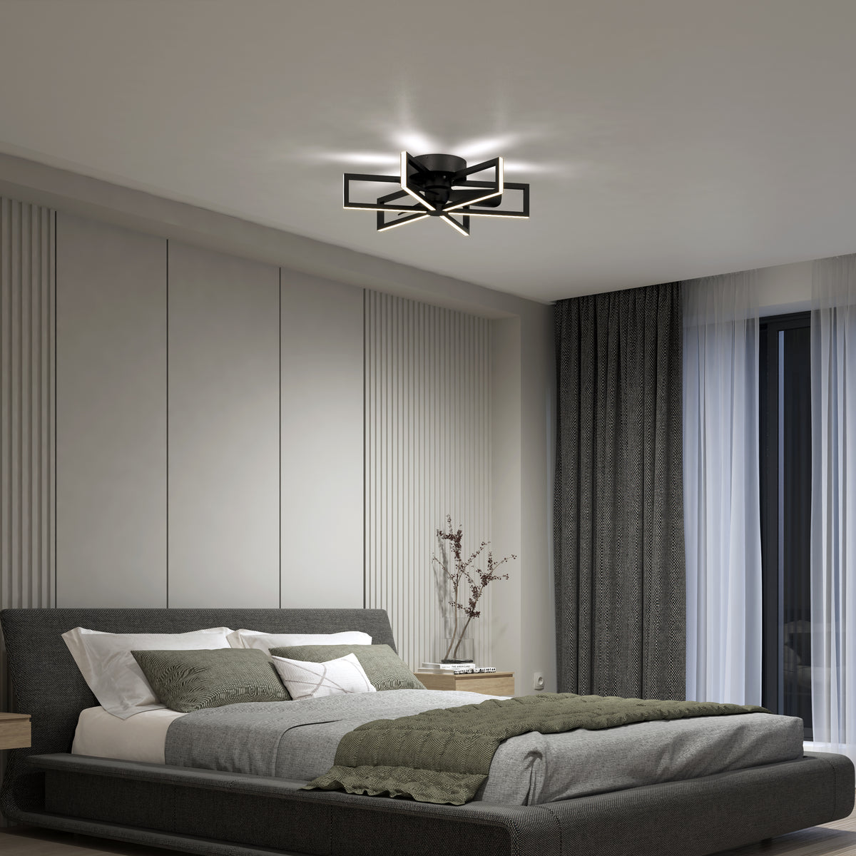 A modern bedroom with a gray upholstered bed, white and green bedding, large gray accent wall panels, a geometric ceiling light, dark curtains, sheer white drapes, and a wooden nightstand with a vase.