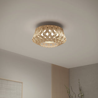 The Artika Kiran 13 in. modern LED flush mount light features a woven geometric wooden shade, casting a warm glow to enhance minimalist rooms with light walls and simple décor.