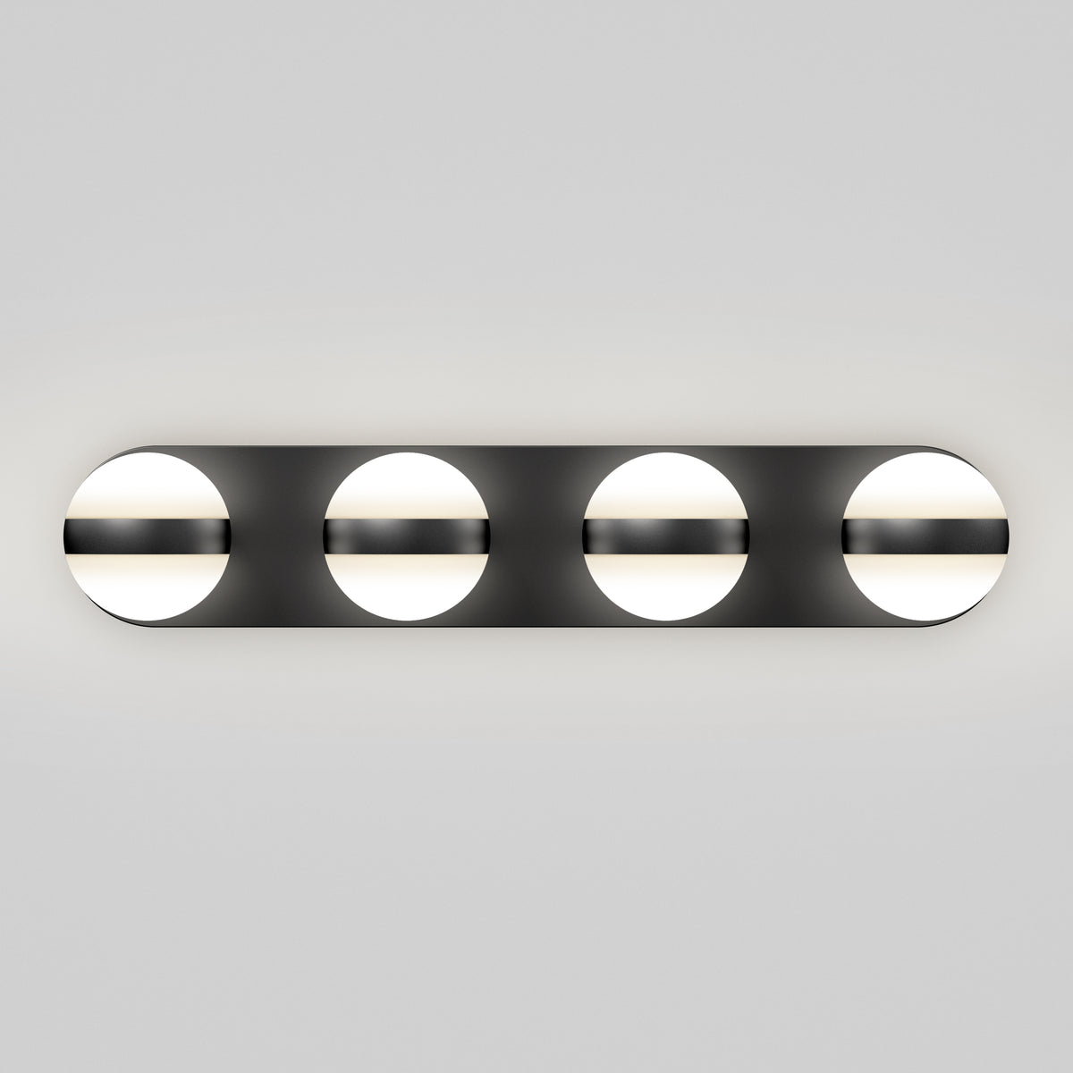 A modern wall light fixture with four evenly spaced circular lights, each partially covered by a horizontal black bar, mounted on a rectangular black base against a plain gray background.