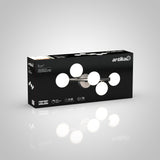 A rectangular black box featuring the Artika Bloom LED vanity light with six round glass bulbs on the front. The package displays product features and a photo of the light fixture.