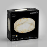 A black box with an image of a round, marble-patterned ceiling light fixture. The brand name “artika” is at the top right, and product details are printed in white and orange on the box.
