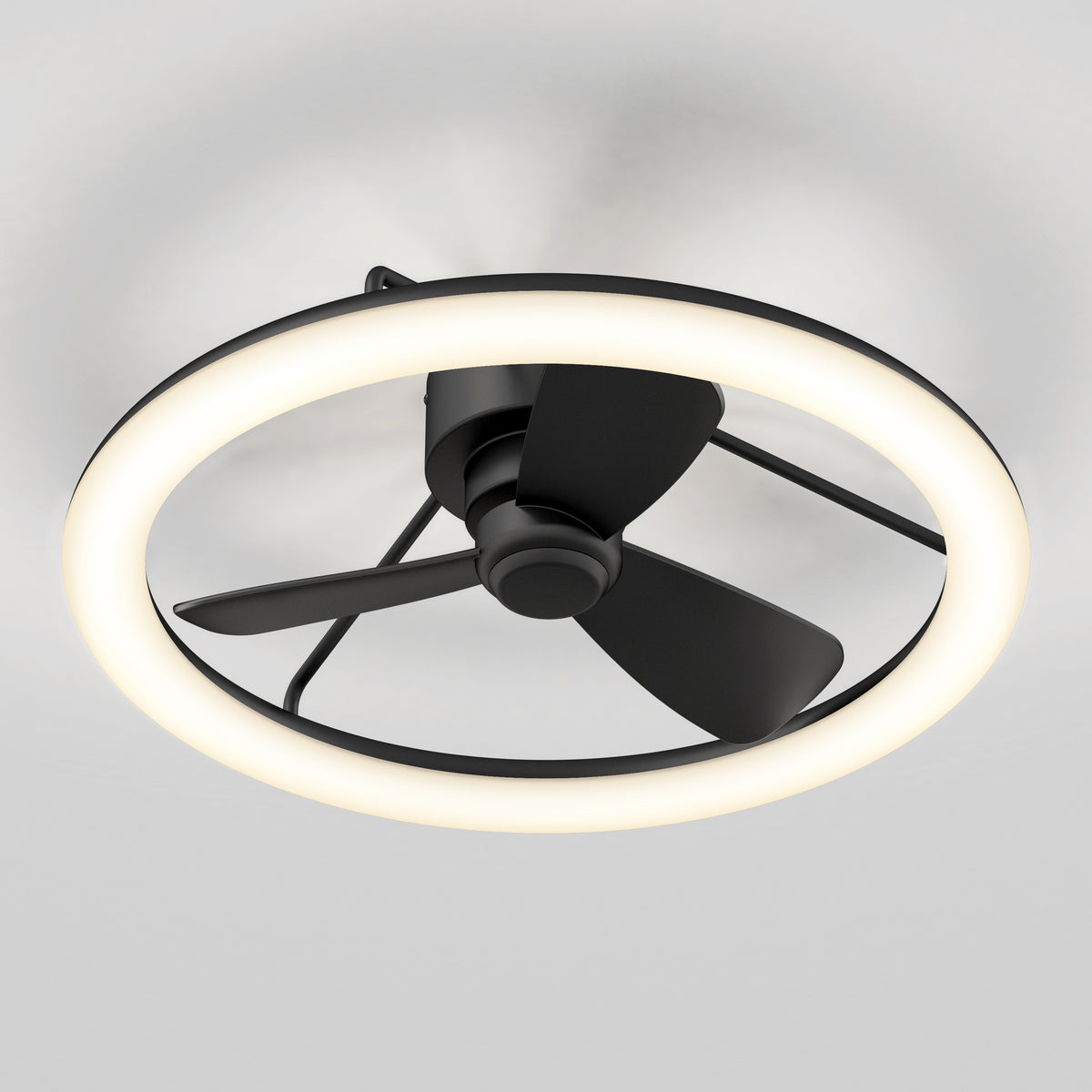A modern ceiling fan with three black blades is enclosed within a circular LED light ring, mounted on a white ceiling.