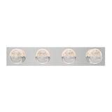 A modern wall-mounted light fixture with four round, dome-shaped lights evenly spaced on a rectangular metallic base, each bulb partially frosted and illuminated.