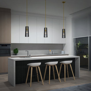 Modern kitchen with a large island, three white bar stools, minimalist cabinetry, built-in oven, a potted plant on the counter, and an Artika Gatsby Mini modern mid-century pendant light above. A window displays greenery outside at night.