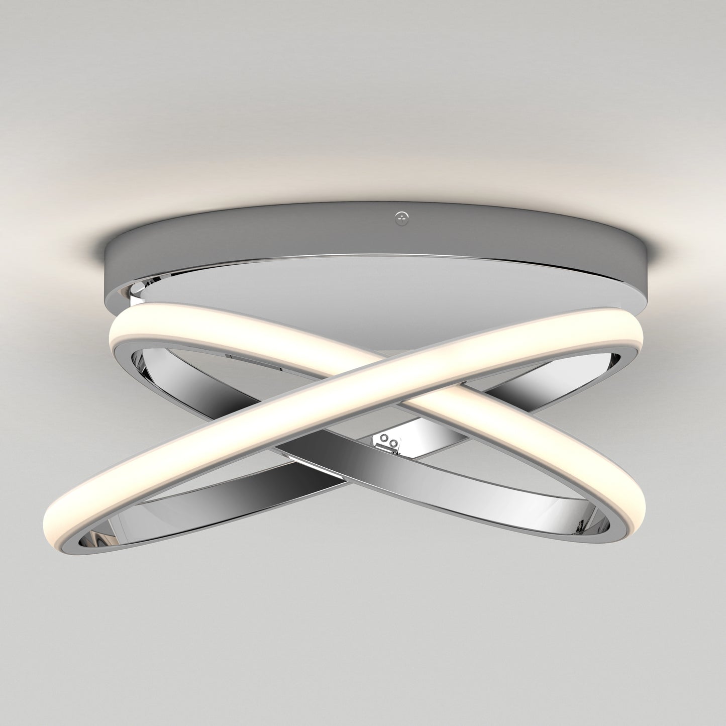 The Orbia modern LED flush mount light 3 CCT by Artika features two interlocking curved LED strips and a polished chrome finish, mounted on a round chrome base against a white ceiling.
