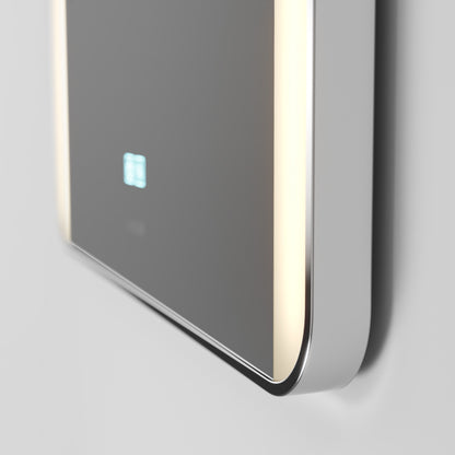 A close-up of a sleek, modern wall-mounted device with a reflective black surface, soft vertical LED lights on the edges, and a small illuminated display.