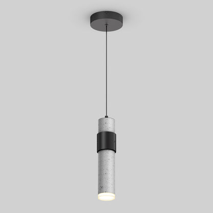 The Barden 1-light LED pendant by Artika features a cylindrical concrete shade with a black accent band and ceiling mount, suspended by a slim black cord against a light gray background.
