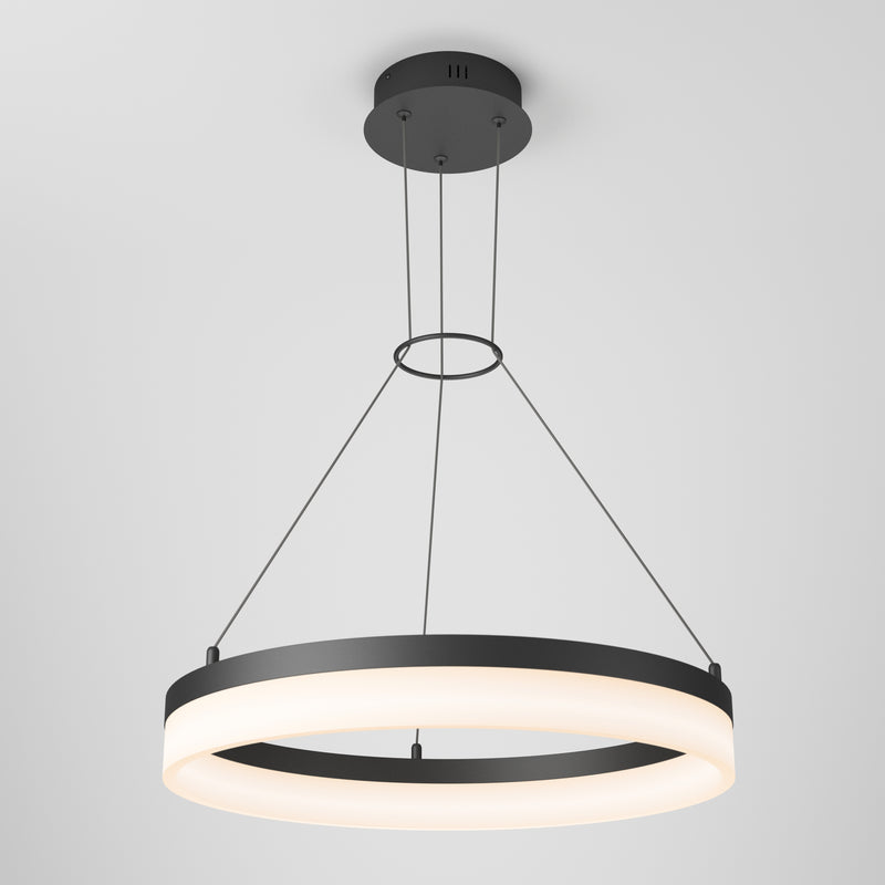 The Artika Optical LED pendant light 3 CCT features a modern circular design with a black frame, a glowing white ring, and hangs from the ceiling on three thin cables attached to a central black mount.