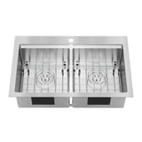 A stainless steel double kitchen sink with two equal-sized rectangular basins, each featuring a grid at the bottom and a central drain hole. There is a single faucet hole at the back of the sink.