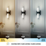 A wall sconce with vertical glass rods shown in three lighting temperatures: warm white (3000K), neutral white (4000K), and cool white (5000K). A color temperature scale and labels are displayed below.