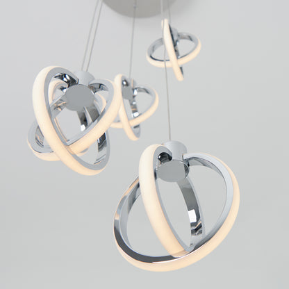 The Artika Soho modern 5-light LED pendant features five intertwined chrome rings with integrated LED lighting, elegantly suspended from the ceiling against a plain light background.