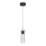 A modern pendant light with a black ceiling mount, a thin black cord, and a cylindrical glass shade surrounding a textured, illuminated inner tube.