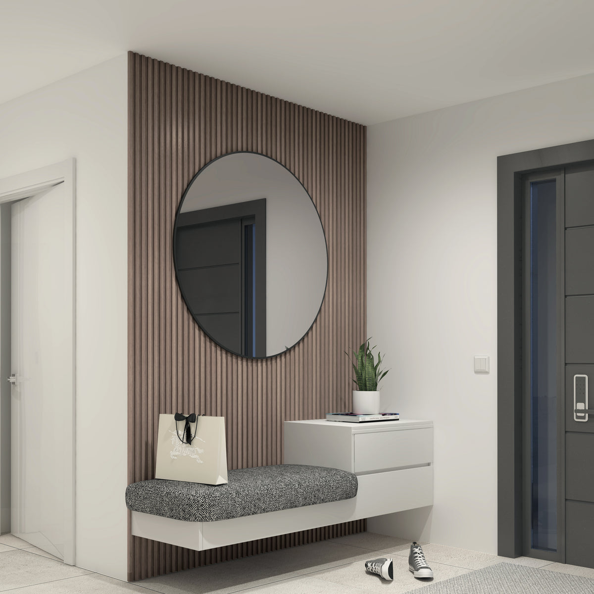 A modern entryway features a round mirror on Artika’s Panolok 30.67 ft wall panel kit, oak finish, with a floating cushioned bench and shopping bag, a small white cabinet with potted plant, and sneakers next to the dark door.
