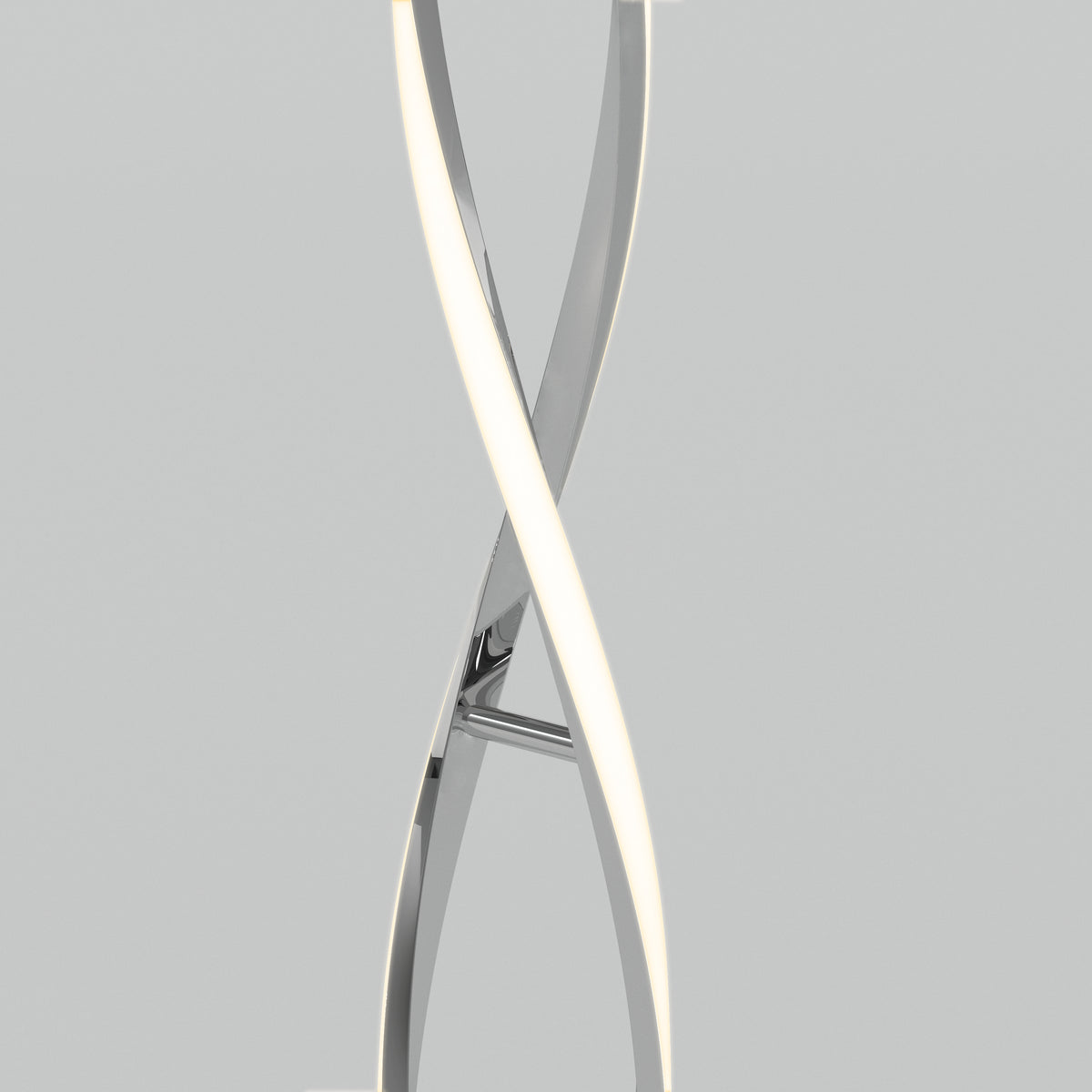 The Artika Swirl modern LED floor lamp features two intertwined, curved metallic and illuminated elements, set against a plain light gray background.