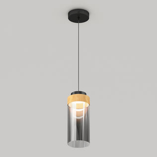The Artika Hanson 1-light LED pendant 5 CCT features a black ceiling mount, black cord, and cylindrical glass shade with a wooden accent near the top, shown against a light gray background.