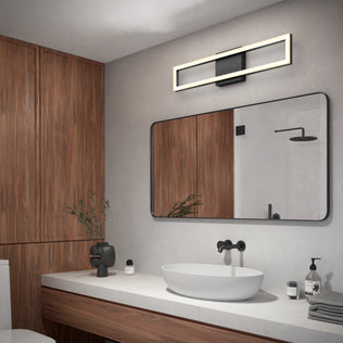 Modern bathroom featuring wood-paneled walls, large mirror, oval white vessel sink, matte black fixtures, minimalist decor, and the Artika Dover 27-in Integrated LED 5-CCT Vanity Light Bar above the mirror.