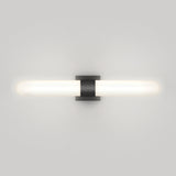 A modern wall-mounted light fixture with a horizontal, cylindrical white frosted glass shade and a central black rectangular bracket, illuminated against a plain white wall.