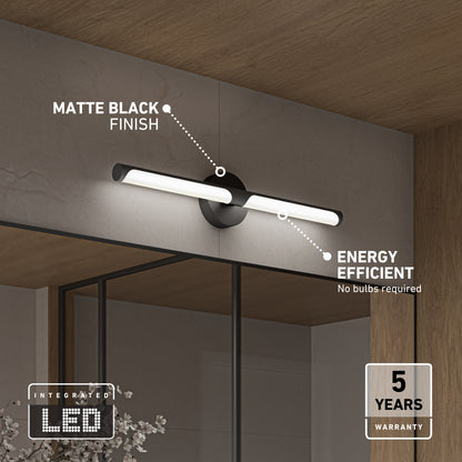 The Artika Ilona LED bathroom vanity light 5 CCT black is mounted above a mirror, showcasing its modern matte black finish, energy efficiency, integrated LED with no bulbs required, and comes with a 5-year warranty.