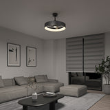 A modern living room with a gray sectional sofa, abstract wall art, a black coffee table, and a unique circular ceiling light. Large window blinds cover the windows, and a plant is in the corner. The room has a minimalist style.