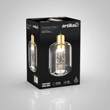 A black Artika box displays a Champagne Globe 1 LED pendant light with a gold finish and a clear glass shade, featuring sparkling bubble details inside. The packaging highlights its 50,000-hour lifespan and 400 lumens.