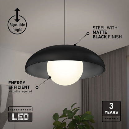 The Artika Boden LED modern mid-century pendant light hangs above a plant, featuring adjustable height, matte black steel finish, energy-efficient integrated LED with 3 CCT options, and a 3-year warranty.