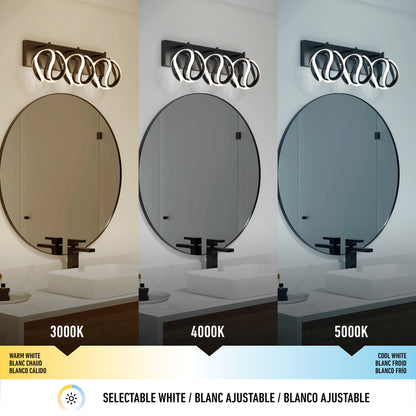 The Artika Vivaldi LED contemporary bathroom vanity light (3 CCT) is displayed above a vanity with round mirror under warm white (3000K), neutral white (4000K), and cool white (5000K) settings, each labeled with text.
