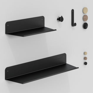 The Artika Sonokit set of shelves and hooks for Sonolok and Sonofold wall panels features minimalist black shelves and hooks, plus black and wood pegs arranged vertically, offering a sleek storage solution with quick installation.