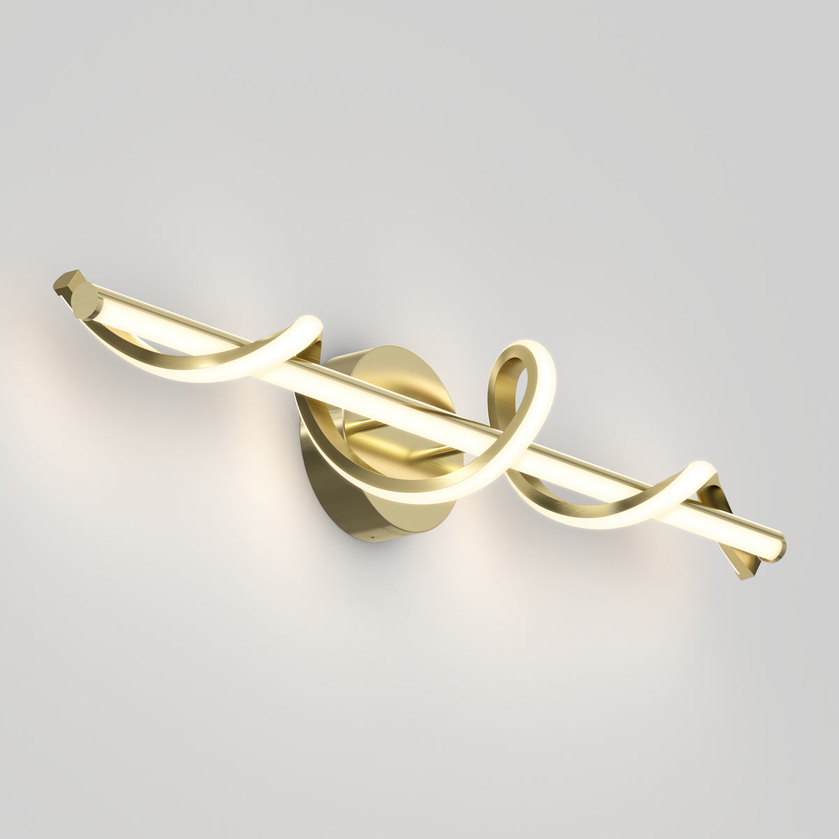 Modern wall-mounted light fixture with a gold base and a tubular LED light, twisted in a decorative spiral design, casting a soft glow against a plain white background.