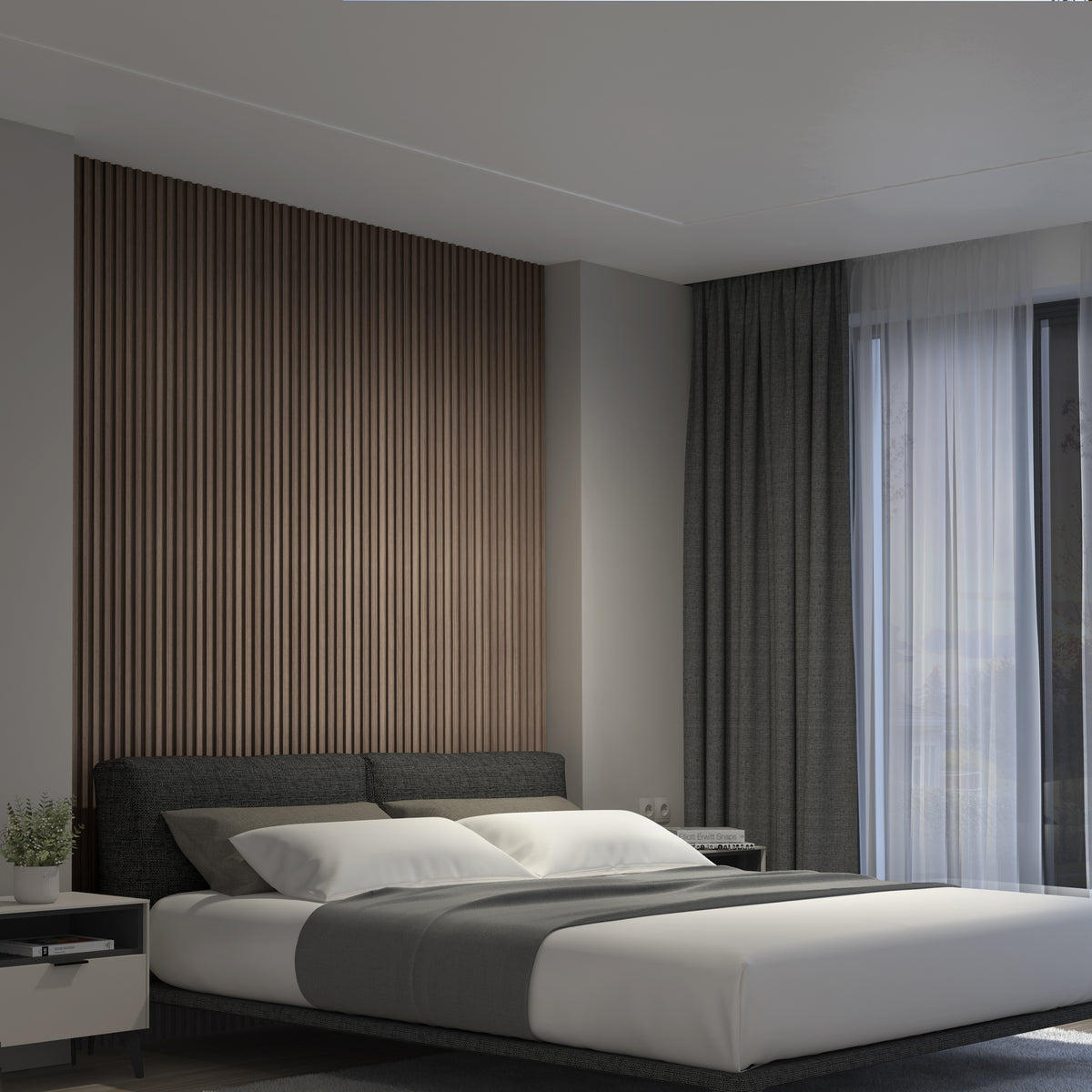 A modern bedroom showcases an Artika Panolok 30.67 ft wall panel kit (pack of 8) as a slatted oak accent wall, plus a bed with white linens, gray throw, and sheer curtains—ideal for fans of Scandinavian design.