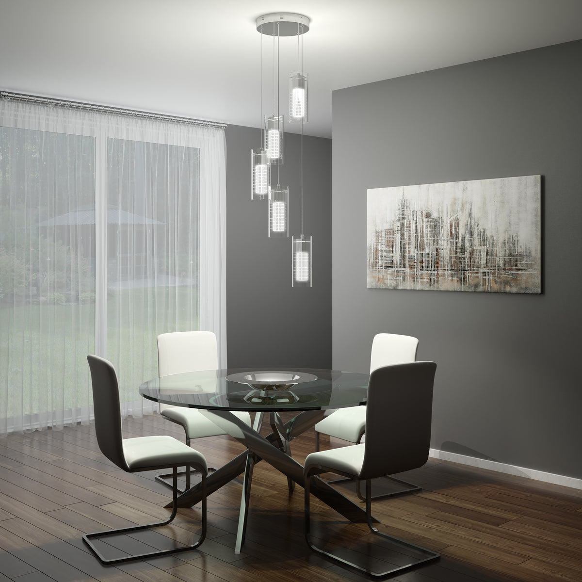 A modern dining room with a glass round table, four white and gray chairs, a hanging contemporary light fixture, abstract wall art, wooden floors, and sheer curtains revealing a green backyard.