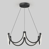 Modern black chandelier with four curved LED light arms suspended by thin black cables from a round ceiling mount, set against a plain light gray background.
