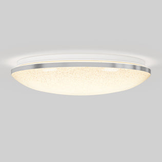 The Artika Sparkle 15 in. LED modern flush mount light, featuring a frosted glass dome and metallic trim, is mounted on a white ceiling and softly illuminates the space with customizable 5 CCT lighting.