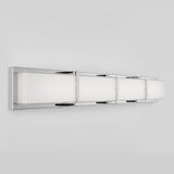A modern wall-mounted light fixture with a long, rectangular shape, featuring a chrome frame and frosted white glass panels, designed for contemporary interiors.