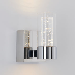 The Artika Essence 1-light LED vanity light features a chrome base and bubble glass, ideal for accent lighting on white walls.