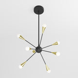 A modern black and gold chandelier with eight arms, each ending in a white globe bulb, radiates symmetrically from a central sphere, suspended from a black ceiling mount against a white background.