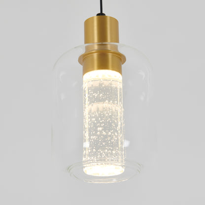 The Artika Champagne Globe modern LED pendant light features a clear glass shade with small bubbles, a cylindrical gold fixture, and a glowing light inside.