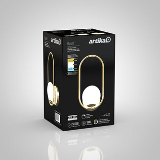 A black and gold Artika box displays the Bloom LED Sconce 3 CCT, featuring a modern oval lamp with a round white light. The front of the packaging highlights key features like lifespan, lumens, and energy rating.