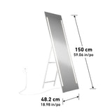 A tall rectangular floor mirror with built-in LED lights on each side is plugged into a wall outlet. The mirror measures 150 cm (59.06 in) high and 48.2 cm (18.98 in) wide and stands on a foldable white frame.