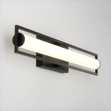 A modern wall-mounted light fixture with a horizontal frosted cylindrical bulb, framed by a rectangular black metal structure, attached to a white wall.