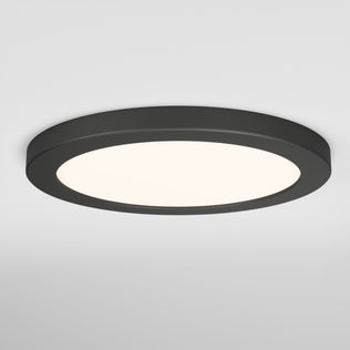 The Artika Europa Disk 9 in. LED modern flush mount light features a black frame and white illuminated center, offering a sleek look for any plain white ceiling. This fixture is 3 CCT adjustable for customizable lighting.