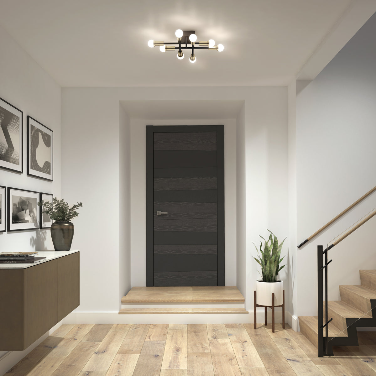Modern entryway with a dark door, wall art, Aristo LED flush mount by Artika, potted plants, and wooden stairs with black railing.