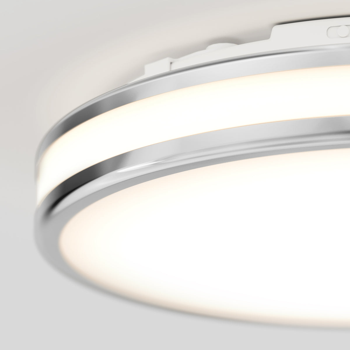 Close-up of the Artika Hemisphere 15 in. LED flush mount light (5 CCT) with chrome finish, mounted on a light-colored ceiling—perfect for stylish bathroom lighting with adjustable brightness.