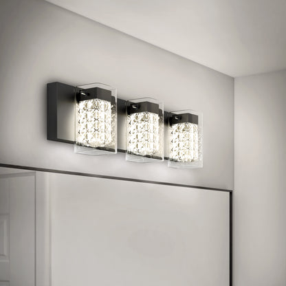 The Artika Crystal Cube LED bathroom vanity light features three square, textured glass shades on a sleek black base, offering bright white light with 5 CCT options—perfect for modern bathrooms above the mirror.