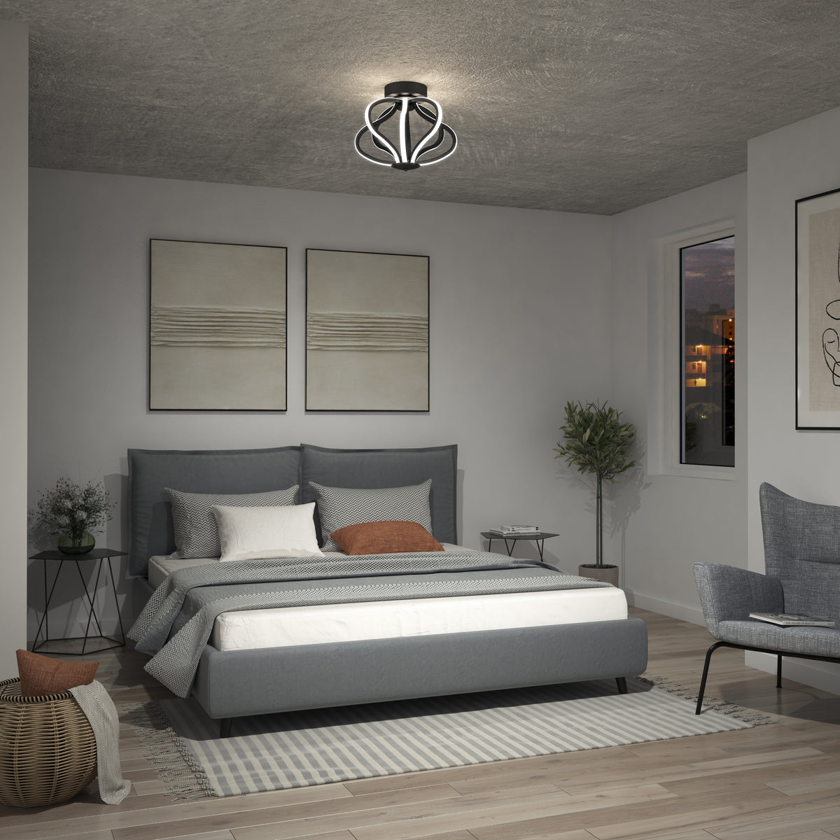 A modern bedroom with a gray bed, neutral bedding, and a geometric ceiling light. The room features minimalist artwork, a potted plant, a small side table, a chair, and a window showing a city view at dusk.